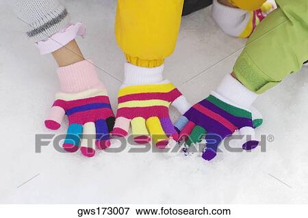 High angle view of three children playing in snow View Large Photo Image Stock Photo - High angle view of three children playing in snow. Fotosearch