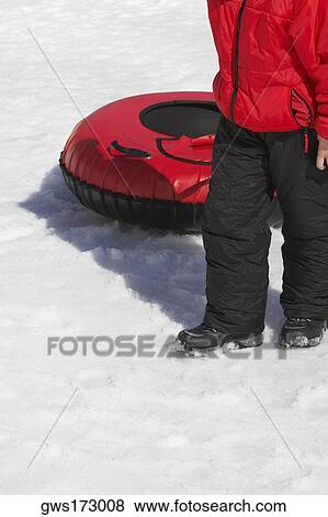 Low section view of a person pulling an inflatable ring View Large Photo Image Stock Photo - Low section view of a person pulling an inflatable ring. Fotosearch