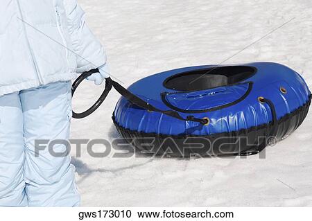 Mid section view of a child pulling an inflatable ring View Large Photo Image Stock Image - Mid section view of a child pulling an inflatable ring. Fotosearch