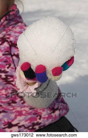 Mid section view of a person holding a snowball View Large Photo Image Stock Image - Mid section view of a person holding a snowball. Fotosearch