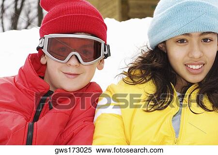 Portrait of a boy and a teenage girl smiling View Large Photo Image Stock Photography - Portrait of a boy and a teenage girl smiling. Fotosearch