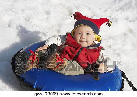 Portrait of a boy reclining on an inner tube View Large Photo Image Stock Photo - Portrait of a boy reclining on an inner tube. Fotosearch