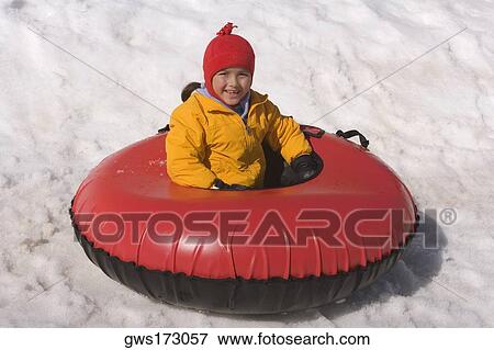 Portrait of a boy sitting in an inflatable ring and smiling View Large Photo Image Stock Photo - Portrait of a boy sitting in an inflatable ring and smiling. Fotosearch