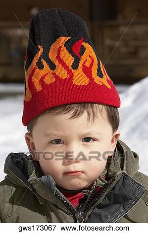 Portrait of a boy wearing a knit hat View Large Photo Image Stock Photo - Portrait of a boy wearing a knit hat. Fotosearch