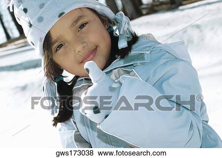 Stock Photo - Portrait of a girl pointing. Fotosearch