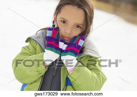 Portrait of a girl showing her gloves View Large Photo Image Stock Photo - Portrait of a girl showing her gloves. Fotosearch