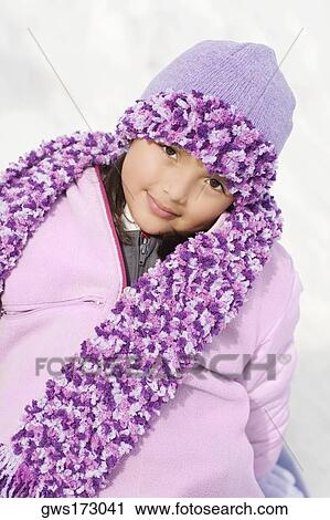 Portrait of a girl sitting in snow and smirking View Large Photo Image Stock Image - Portrait of a girl sitting in snow and smirking. Fotosearch