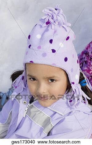 Portrait of a girl sitting in snow View Large Photo Image Stock Image - Portrait of a girl sitting in snow. Fotosearch