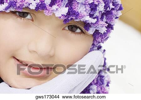Portrait of a girl smiling with her hand on her chin View Large Photo Image Picture - Portrait of a girl smiling with her hand on her chin. Fotosearch