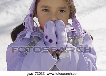 Portrait of a girl with her hands covering her mouth View Large Photo Image Stock Image - Portrait of a girl with her hands covering her mouth. Fotosearch