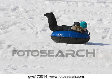 Side profile of a child lying on an inflatable ring View Large Photo Image Picture - Side profile of a child lying on an inflatable ring. Fotosearch