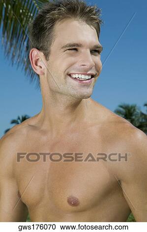Stock Image - Close-up of a young man smiling. Fotosearch