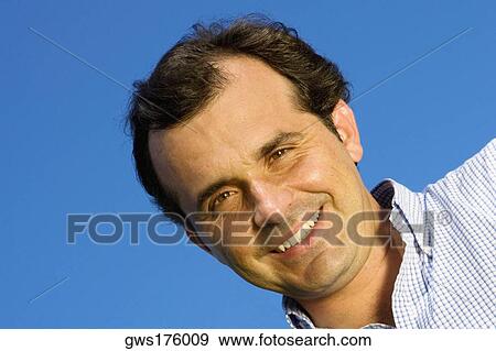 Stock Photo - Portrait of a mature man smiling. Fotosearch