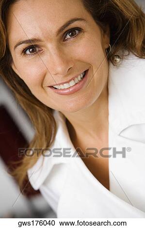 Portrait of a mature woman smiling View Large Photo Image Stock Image - Portrait of a mature woman smiling. Fotosearch