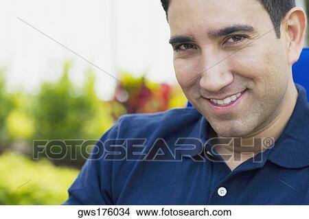 Portrait of a mid adult man smiling View Large Photo Image Picture - Portrait of a mid adult man smiling. Fotosearch