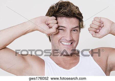 Portrait of a mid adult man stretching his arms View Large Photo Image Stock Image - Portrait of a mid adult man stretching his arms. Fotosearch