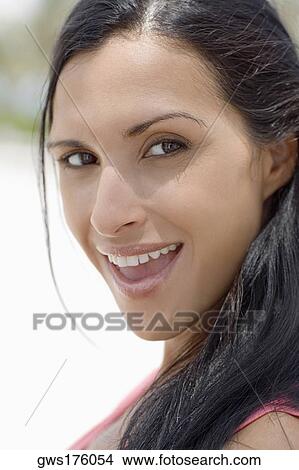 Portrait of a young woman smiling View Large Photo Image Picture - Portrait of a young woman smiling. Fotosearch