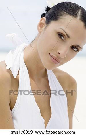 Portrait of a young woman smirking View Large Photo Image Stock Photo - Portrait of a young woman smirking. Fotosearch