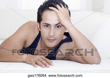 Portrait of a young woman with her hands in her hair View Large Photo Image Picture - Portrait of a young woman with her hands in her hair. Fotosearch