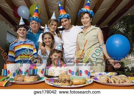 Portrait of a family celebrating a birthday party View Large Photo Image Stock Image - Portrait of a family celebrating a birthday party. Fotosearch