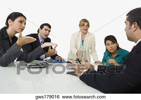Five business executives discussing in a meeting View Large Photo Image Stock Photograph - Five business executives discussing in a meeting. Fotosearch
