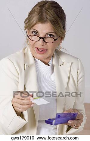 Portrait of a businesswoman giving a business card View Large Photo Image Stock Image - Portrait of a businesswoman giving a business card. Fotosearch