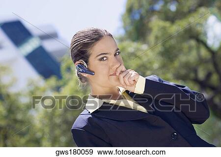 Portrait of a businesswoman wearing a hands free device View Large Photo Image Stock Photo - Portrait of a businesswoman wearing a hands free device. Fotosearch