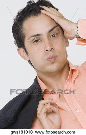 Portrait of a businessman suffering from a headache View Large Photo Image Stock Image - Portrait of a businessman suffering from a headache. Fotosearch