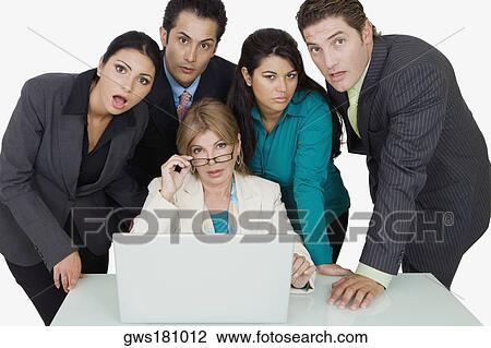 Portrait of a businesswoman adjusting her eyeglasses and two businesswomen with two businessmen standing beside her View Large Photo Image Stock Image - Portrait of a businesswoman adjusting her eyeglasses and two businesswomen with two businessmen standing beside her. Fotosearch