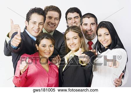 Stock Photography - Portrait of a group of business executives making thumbs up signs and smiling. Fotosearch