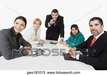 Portrait of three businesswomen with two businessmen watching a presentation View Large Photo Image Stock Image - Portrait of three businesswomen with two businessmen watching a presentation. Fotosearch