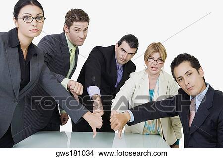 Portrait of two businesswomen and three businessmen showing thumbs down sign View Large Photo Image Picture - Portrait of two businesswomen and three businessmen showing thumbs down sign. Fotosearch