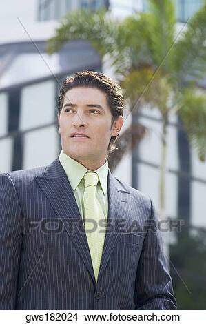 Close-up of a businessman View Large Photo Image Picture - Close-up of a businessman. Fotosearch
