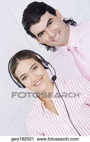 Portrait of a businessman and a businesswoman smiling View Large Photo Image Stock Image - Portrait of a businessman and a businesswoman smiling. Fotosearch
