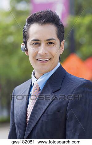 Portrait of a businessman smiling View Large Photo Image Stock Image - Portrait of a businessman smiling. Fotosearch