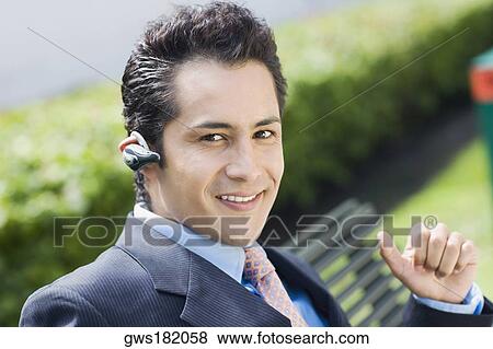Portrait of a businessman smiling View Large Photo Image Stock Photo - Portrait of a businessman smiling. Fotosearch