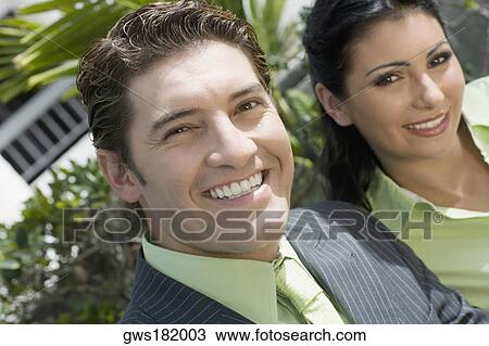 Portrait of a businessman smiling with a businesswoman View Large Photo Image Stock Image - Portrait of a businessman smiling with a businesswoman. Fotosearch