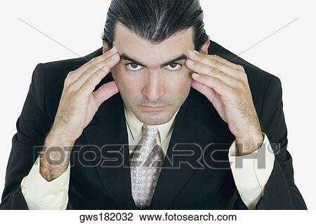 Portrait of a businessman thinking with his head in his hands View Large Photo Image Stock Image - Portrait of a businessman thinking with his head in his hands. Fotosearch