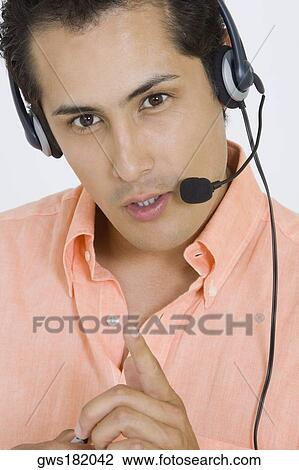 Portrait of a businessman wearing a headset View Large Photo Image Stock Image - Portrait of a businessman wearing a headset. Fotosearch