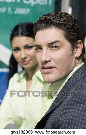 Portrait of a businessman with a businesswoman beside him View Large Photo Image Stock Photo - Portrait of a businessman with a businesswoman beside him. Fotosearch
