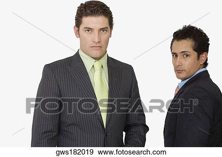 Portrait of two businessmen standing together View Large Photo Image Stock Photo - Portrait of two businessmen standing together. Fotosearch