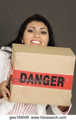 Portrait of a businesswoman carrying a cardboard box View Large Photo Image Stock Image - Portrait of a businesswoman carrying a cardboard box. Fotosearch