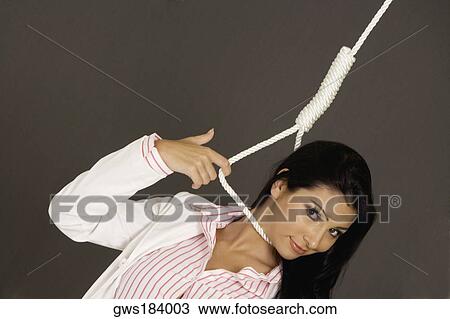 Portrait of a businesswoman with a noose around her neck View Large Photo Image Stock Image - Portrait of a businesswoman with a noose around her neck. Fotosearch