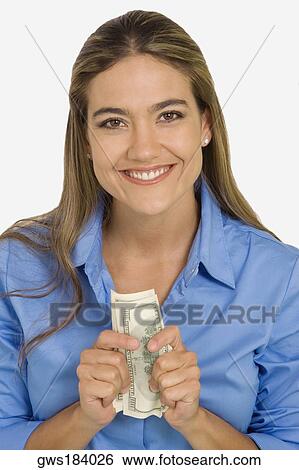 Portrait of a young woman holding American paper currency View Large Photo Image Stock Photograph - Portrait of a young woman holding American paper currency. Fotosearch