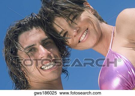 Portrait of a mid adult couple smiling View Large Photo Image Stock Photography - Portrait of a mid adult couple smiling. Fotosearch