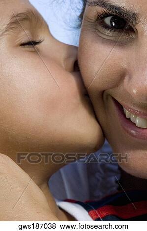 Stock Photo - Close-up of a boy kissing his mother. Fotosearch