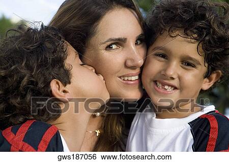 Close-up of a mid adult woman with her two sons View Large Photo Image Stock Photograph - Close-up of a mid adult woman with her two sons. Fotosearch