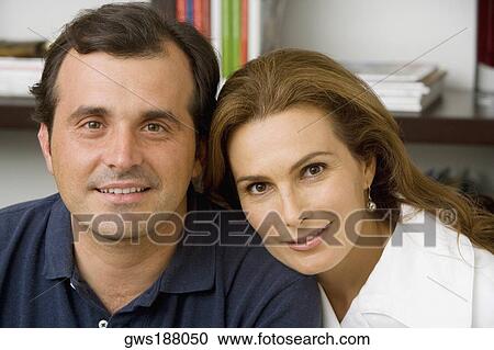Portrait of a mature couple smiling View Large Photo Image Stock Image - Portrait of a mature couple smiling. Fotosearch