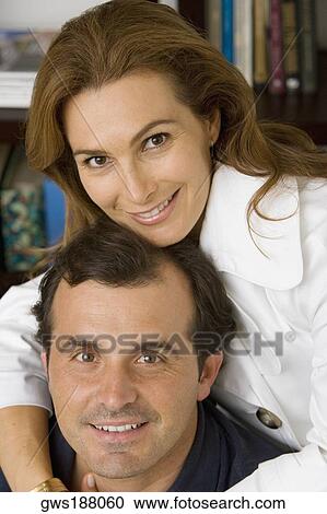 Portrait of a mature woman hugging her husband and smiling View Large Photo Image Stock Image - Portrait of a mature woman hugging her husband and smiling. Fotosearch
