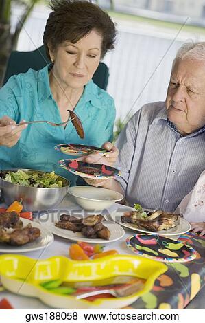 Stock Photo - Senior couple having lunch. Fotosearch